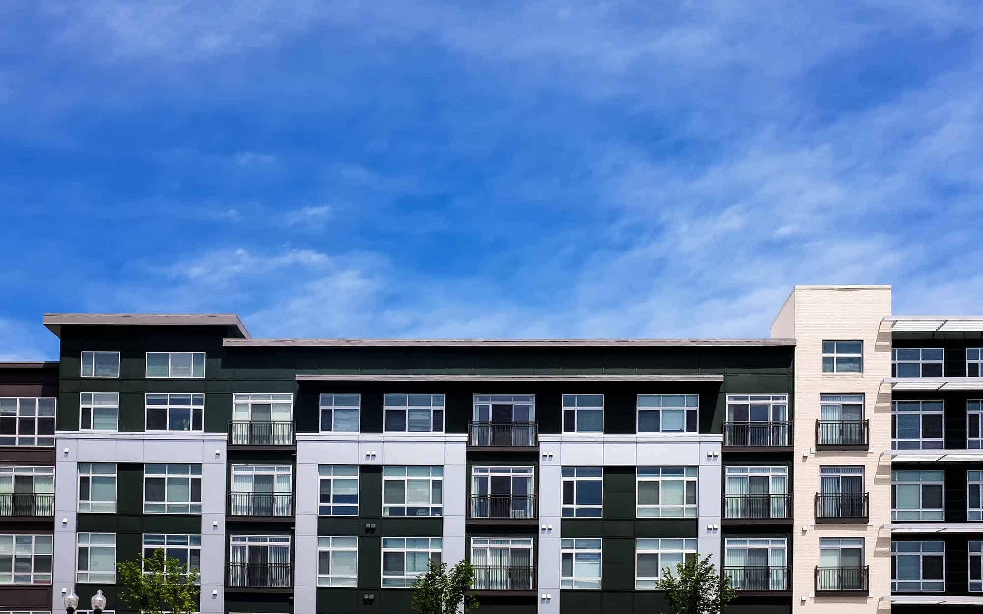 Modern apartment buildings on a sunny day with a blue sky