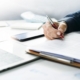 Close-up of an insurance agent looking over documents