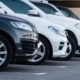 Side view of a row of parked cars