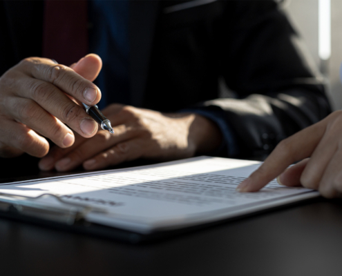 Side view of two people reviewing insurance document