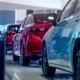 Side view of a single file line of cars