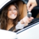 New driver being handed keys to the car