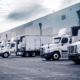 Row of commercial vehicles at warehouse