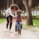 Young child learning to ride a bike