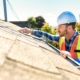 worker inspecting roof