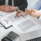 Insurance agent explaining insurance policy to customer in office room