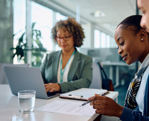 going through terms of agreement during meeting with insurance agent