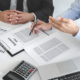 Insurance agent explaining insurance policy to customer in office room